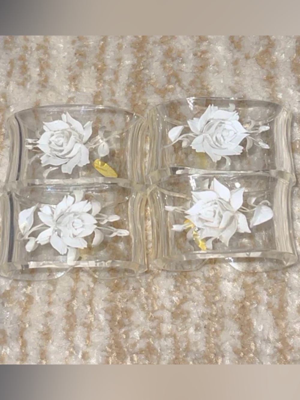 Vintage 4 engraved rose napkin holders. Good condition.